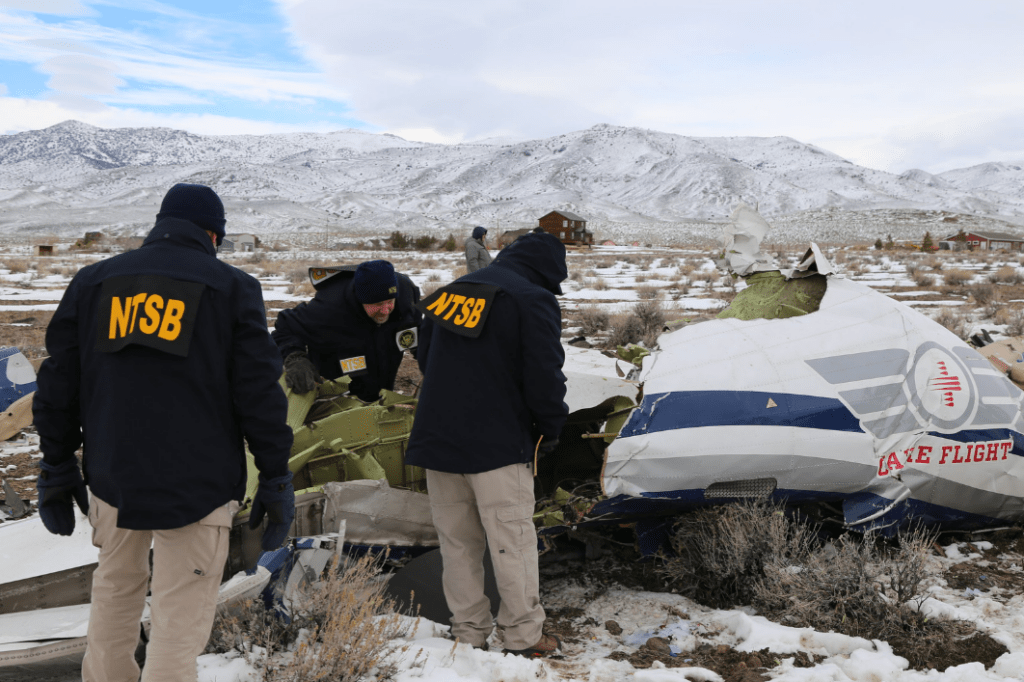Aviation investigators analyzing evidence during an official aircraft accident investigation