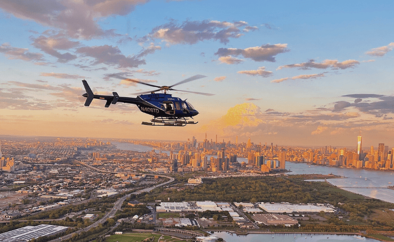 Houston helicopter transfer over city skyline with seamless AeroLux Charter connection