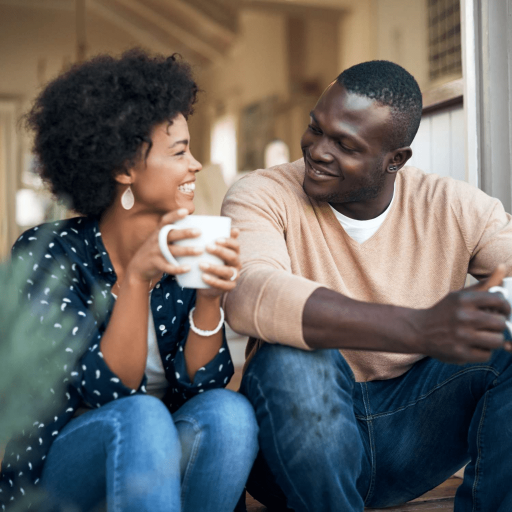 A long-term married couple having a calm private conversation at home