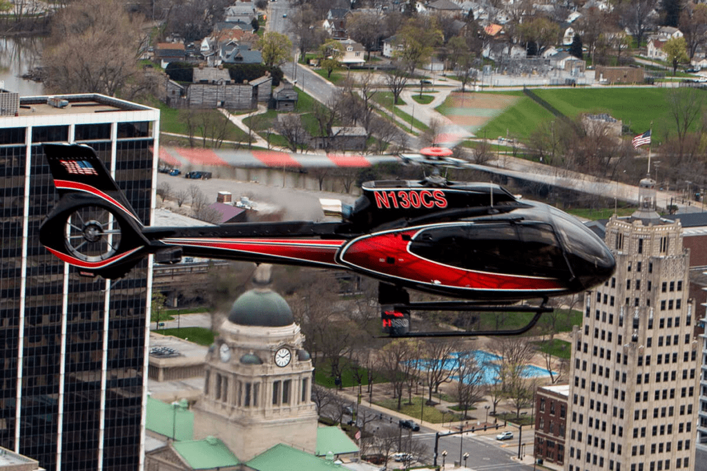 Luxury helicopter flying over city showcasing premium comfort and high-end aerial experience