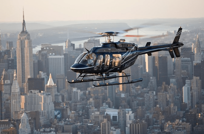 Helicopter flying above city skyline illustrating popular Austin TX scenic tour options