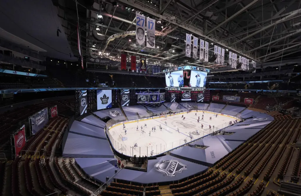 Crowded sports arena during professional game highlighting brand exposure through partnerships
