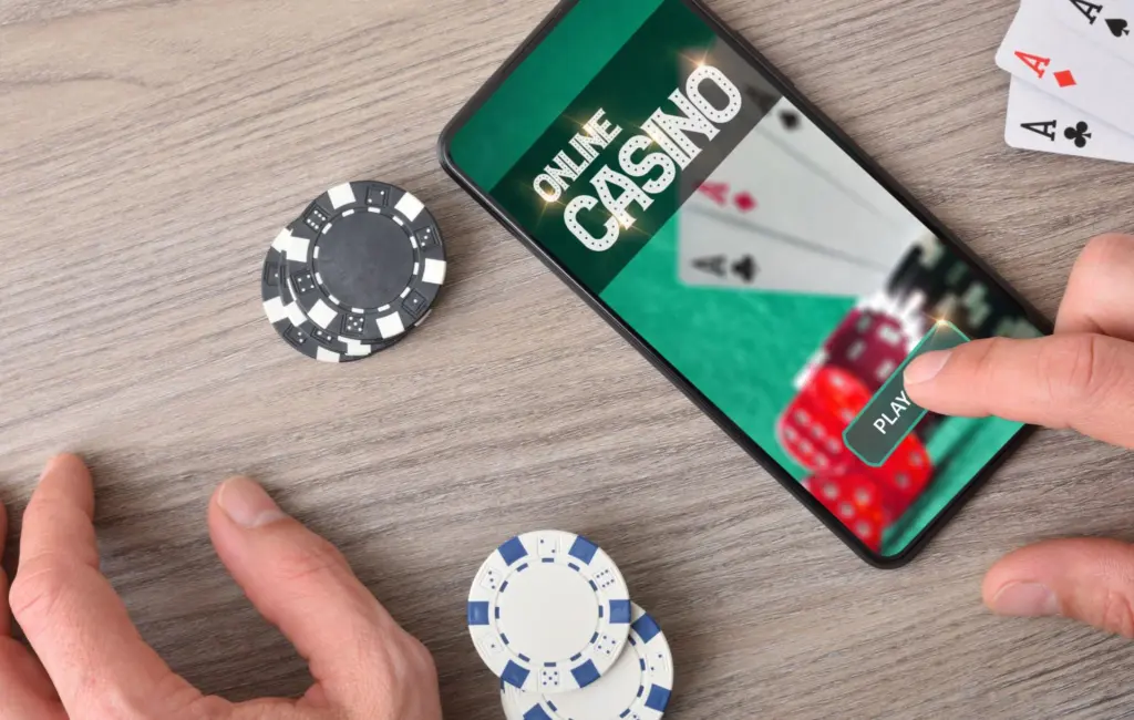 Mobile casino interface on smartphone showing slot games and navigation menu